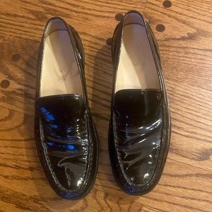 Tod’s dark brown patent driving loafers. Very dark brown.